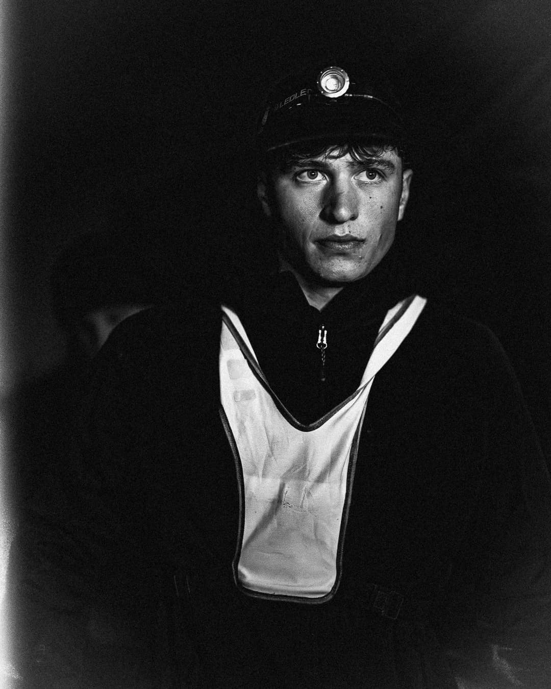A Last Soul Ultra runner wearing a headlamp during a night yard